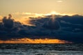 Dramatic and picturesque evening sunset scene over the sea. Storm passing, dramatic clouds after storm at sunset. Royalty Free Stock Photo