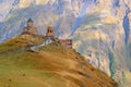 Fantastic View of the Gergeti Trinity Church or Tsminda Sameba on the Hilltop with Mount Kazbek in the Backdrop, Georgia Royalty Free Stock Photo