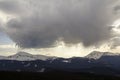 Fantastic view of huge white dark foreboding stormy cloud covering blue sky low over mountains Hoverla and Petros in Carpathian m Royalty Free Stock Photo