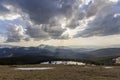 Fantastic view of huge white dark foreboding stormy cloud covering blue sky low over mountains Hoverla and Petros in Carpathian m Royalty Free Stock Photo