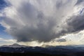 Fantastic view of huge white dark foreboding stormy cloud covering blue sky low over mountains Hoverla and Petros in Carpathian mo Royalty Free Stock Photo