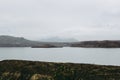 Fantastic view of Iceland in spring. Bright twilight of early white nights over the dreamy landscapes with grey water of the lake Royalty Free Stock Photo