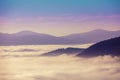 Mountain ridge above the clouds Royalty Free Stock Photo