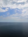 Fantastic white clouds on blue sky horizon. Blue sea calm and blue sky with clouds background