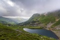 Fantastic wide peaceful view of blue lake in green valley and sm Royalty Free Stock Photo