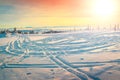 Fantastic winter landscape with colorful sunset and snowy road, Hargita mountains, Carpathians, Transylvania, Romania, Europe. Royalty Free Stock Photo