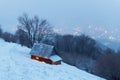 Fantastic winter landscape with glowing wooden house Royalty Free Stock Photo