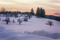 Fantastic winter landscape during sunset. colorful sky glowing with sunlight. Royalty Free Stock Photo