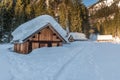 Fantastic winter landscape with wooden house in snowy mountains Royalty Free Stock Photo