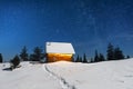 Fantastic winter landscape with wooden house in snowy mountains Royalty Free Stock Photo