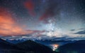 Fantastic winter meteor rain and mountains in the mist. Royalty Free Stock Photo