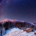 Fantastic winter meteor shower and the snow-capped mountains Royalty Free Stock Photo