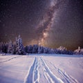 Fantastic winter meteor shower and the snow-capped mountains Royalty Free Stock Photo