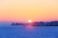 Fantastic winter morning. Landscape with fields, mountain, forest and meadow covered with snow. Beautiful sunrise. Royalty Free Stock Photo