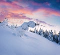 Fantastic winter sunrise in Carpathian mountains with snow cower