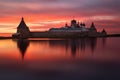 Fantastically beautiful fiery sunset on on the Holy Lake with a view of the Solovetsky Spaso-Preobrazhensky Monastery.Russia. Royalty Free Stock Photo