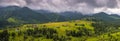 Amazing view of the mountain village Dzembronya foggy morning in the mountains in summer. Royalty Free Stock Photo