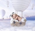 Fantasty image of little boy flying a balloon