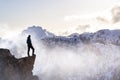 Fantasy Adventure Composite with a Man on top of a Mountain Cliff