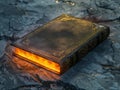 Fantasy ancient leather book with glowing orange pages Royalty Free Stock Photo