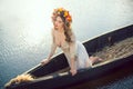 Fantasy art photo of a beautiful lady lying in boat Royalty Free Stock Photo