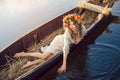 Fantasy art photo of a beautiful lady lying in boat Royalty Free Stock Photo