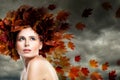 Fantasy Autumn Season Concept. Autumn Model Woman against Cloudy