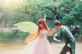 fantasy couple together. Fairy man groom elf Prince kisses hand of woman bride pixie. Themed wedding. Red hair girl Royalty Free Stock Photo