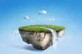 Fantasy floating island with river stream on green grass Royalty Free Stock Photo