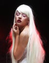 Fantasy Halloween Vampire woman portrait. Beauty Sexy Vampire with long white hair.