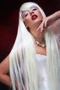 Fantasy Halloween Vampire woman portrait. Beauty Sexy Vampire with long white hair. Royalty Free Stock Photo