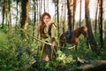 Fantasy medieval woman hunting in mystery forest Royalty Free Stock Photo