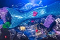 Close-up of fantasy mermaid in deep ocean shocked because water pollution. Plastic water bottles and bags pollution on Royalty Free Stock Photo