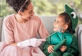 Fantasy, mother and child in halloween costume at home with girl in a dinosaur outfit and mom as a fairy princess. Smile