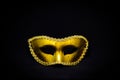 Fantasy mystery golden mask isolated on black background. Royalty Free Stock Photo