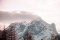 Fantasy pink color effect of winter panorama of Mount Civetta