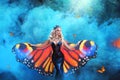 Fantasy portrait of a sensual blonde girl with large silk butterfly wings Royalty Free Stock Photo