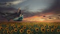 Fantasy portrait of young woman in black dress on the boat over sunflowers field Royalty Free Stock Photo