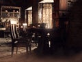 Fantasy scene in a medieval tavern showing a table with chairs Royalty Free Stock Photo