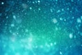 Fantasy-themed background with green-blue bokeh, falling snow, and shimmering sparkles Royalty Free Stock Photo