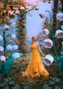 A fantasy woman forest fairy. Fashion model in yellow dress with butterfly wings walks in autumn nature. Large flowers