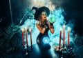 Fantasy woman witch creates magic, dark gothic room full smoke sparkles candles burning, magical crystal ball sexy witch