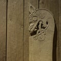Fantasy wood carving of a lion head from the viking age
