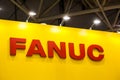 Fanuc company logo on the wall.