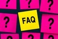 FAQ - frequently asked questions - inscription on yellow sticker. Collection of frequently asked questions on any topic and Royalty Free Stock Photo