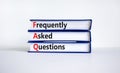 FAQ frequently asked questions symbol. Concept words `FAQ frequently asked questions` on books on a beautiful white background. Royalty Free Stock Photo