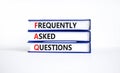 FAQ frequently asked questions symbol. Concept words FAQ frequently asked questions on books on a beautiful white table, white Royalty Free Stock Photo