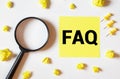 FAQ, Q and A and SEO idea. Question and answer or analysis concept. Magnifying glass, book and crumpled paper