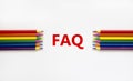 FAQ symbol. Concept word `FAQ, frequently asked questions` on a beautiful white background. Colored pencils. Business and FAQ, Royalty Free Stock Photo