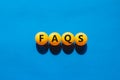 FAQS, frequently asked questions symbol. Orange table tennis balls with the word `FAQS, frequently asked questions`. Beautiful